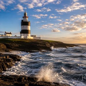 Hook Head lighthouse against breaking waves